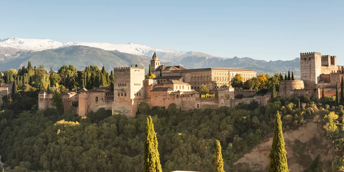 Panorama of the Alhambra in Grenada, Andalusia, Spain with the mountains behind it