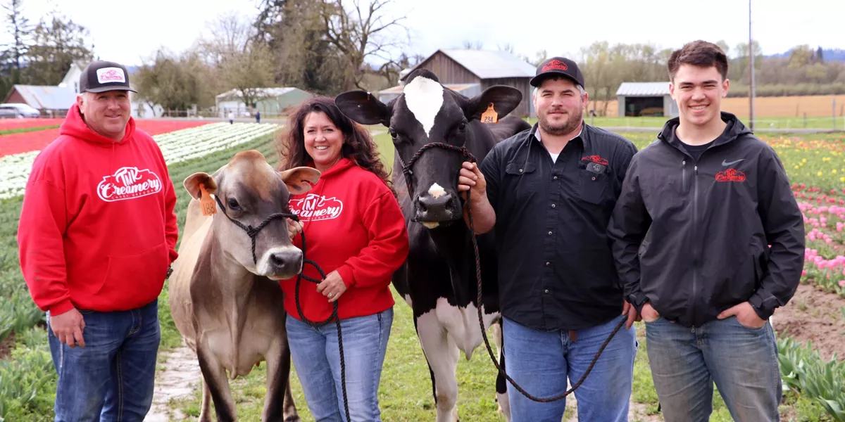 Koch Family on their farm with cows in Oregon