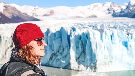 Woman looking at a glacier in the UNESCO-listed Los Glaciares National Park in Patagonia