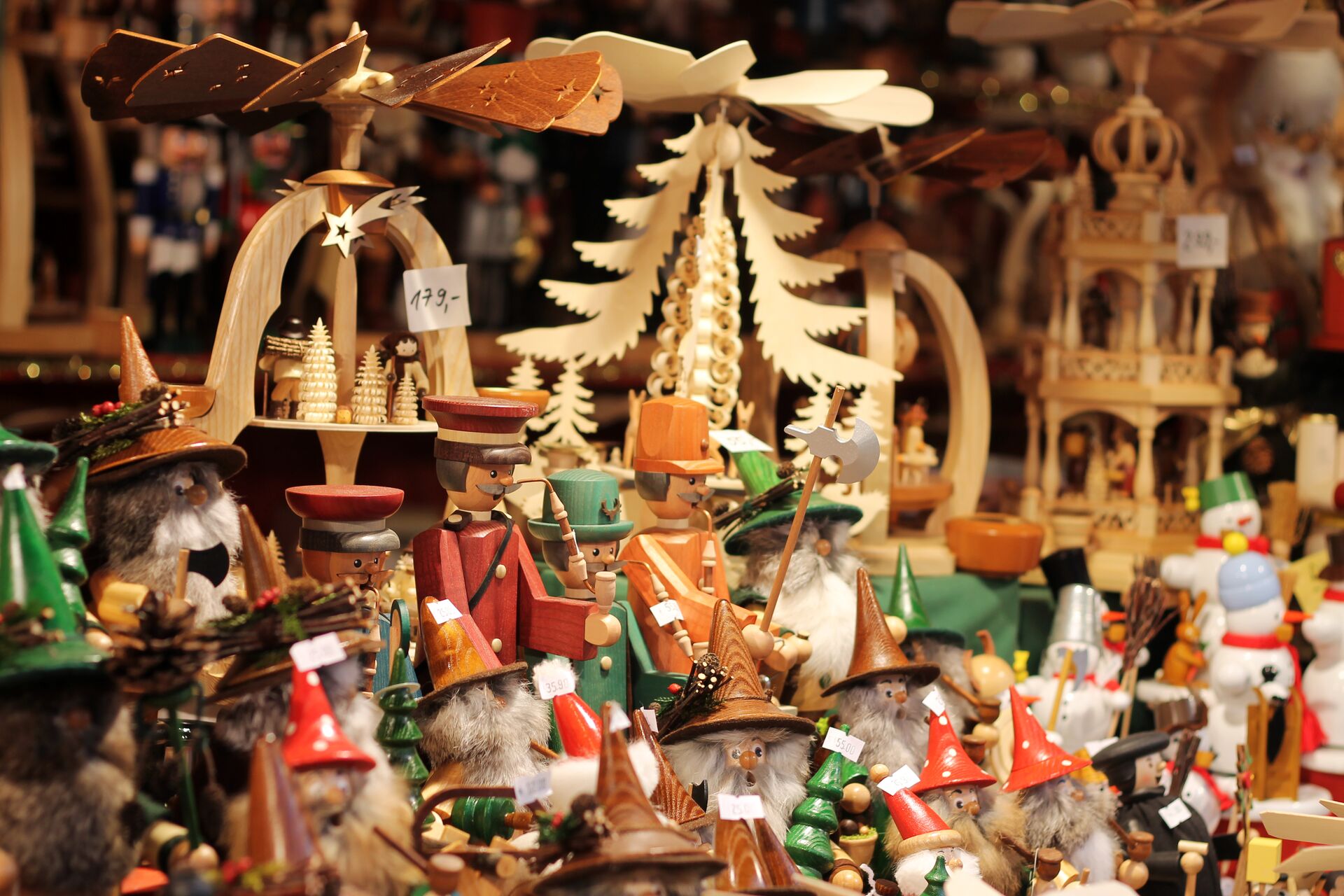 Close up image of traditional wooden Christmas Ornaments on display at a German Christmas Market
