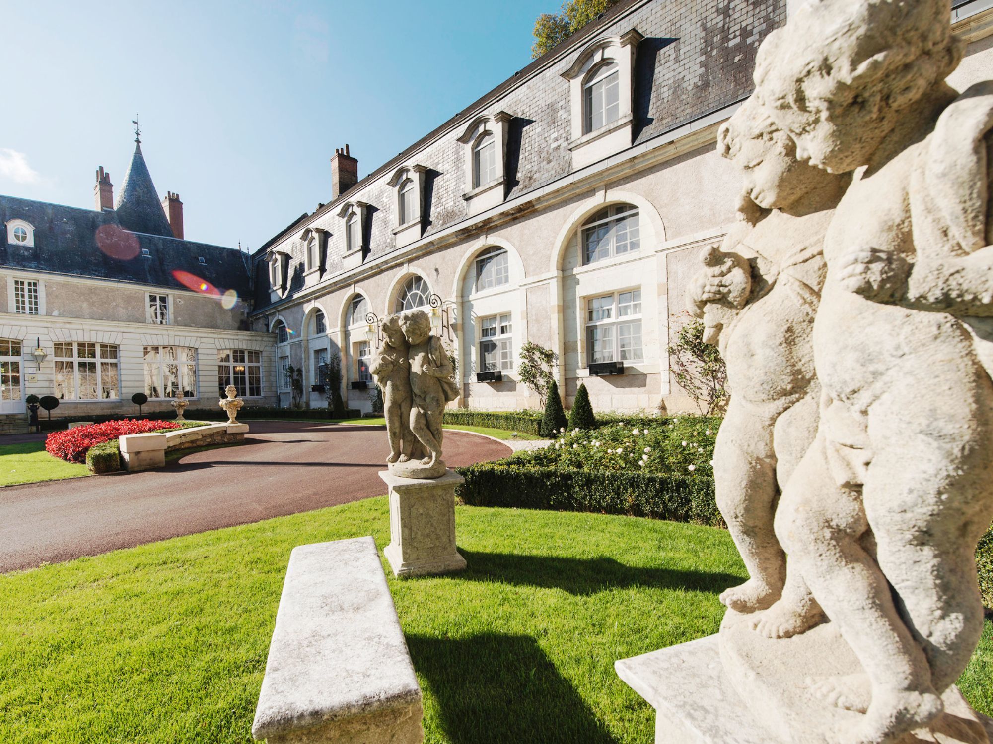 Sculptures next to the entrance to Chateau De Beauvois in France