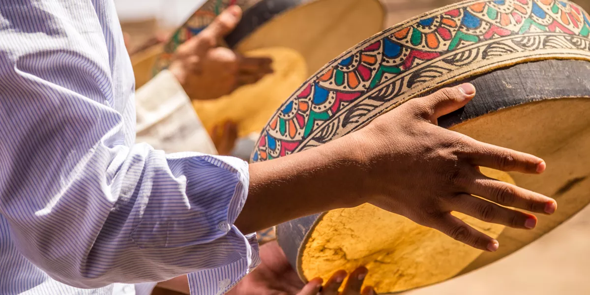Berber people playing tambourine in Merzouga Desert, Morocco