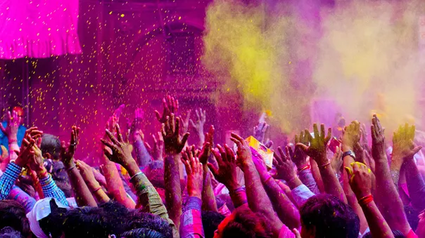 Hands covered with colourful powder during Holi celebration