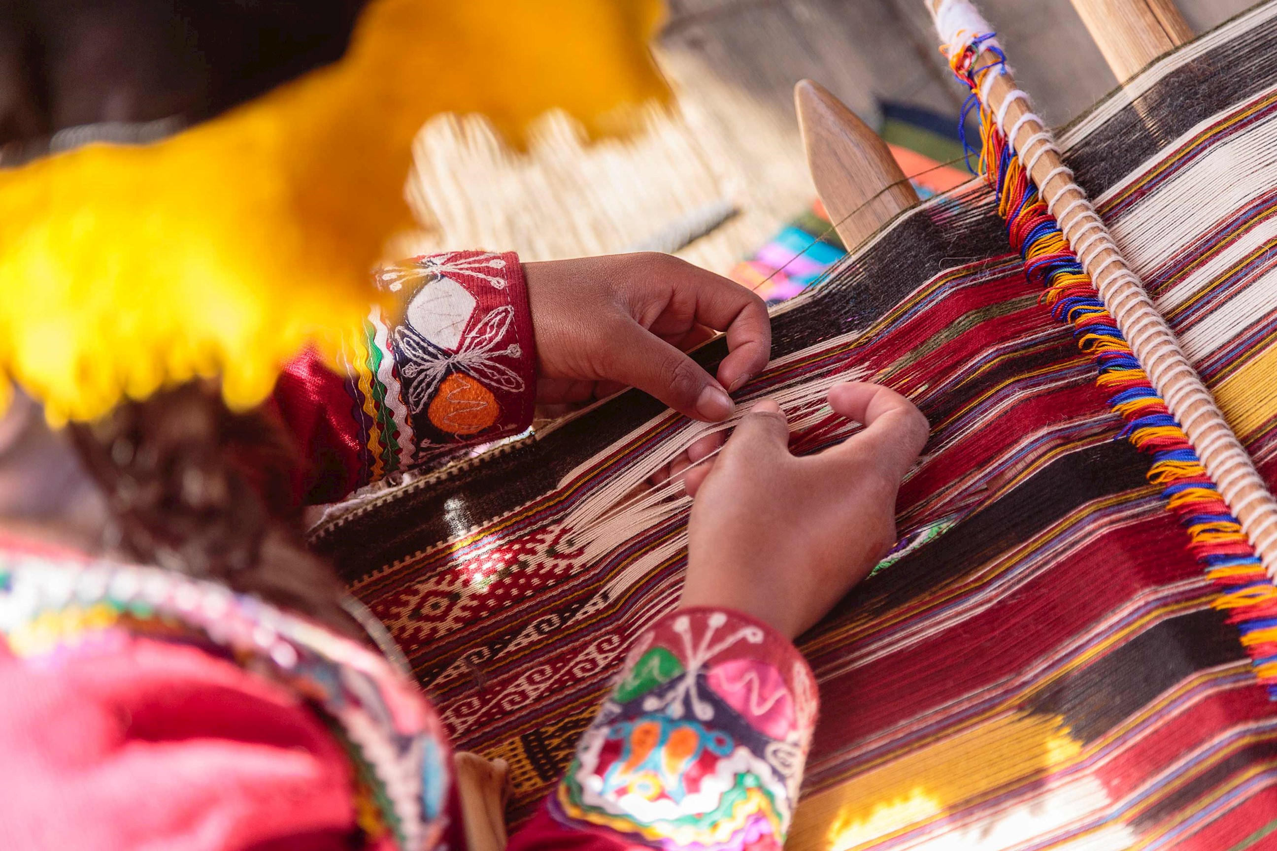 woman-weaving-sacred-valley-peru.jpg