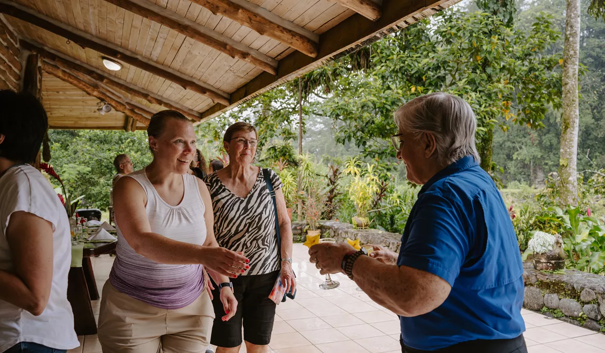 Women Taking Drinks From Older Woman