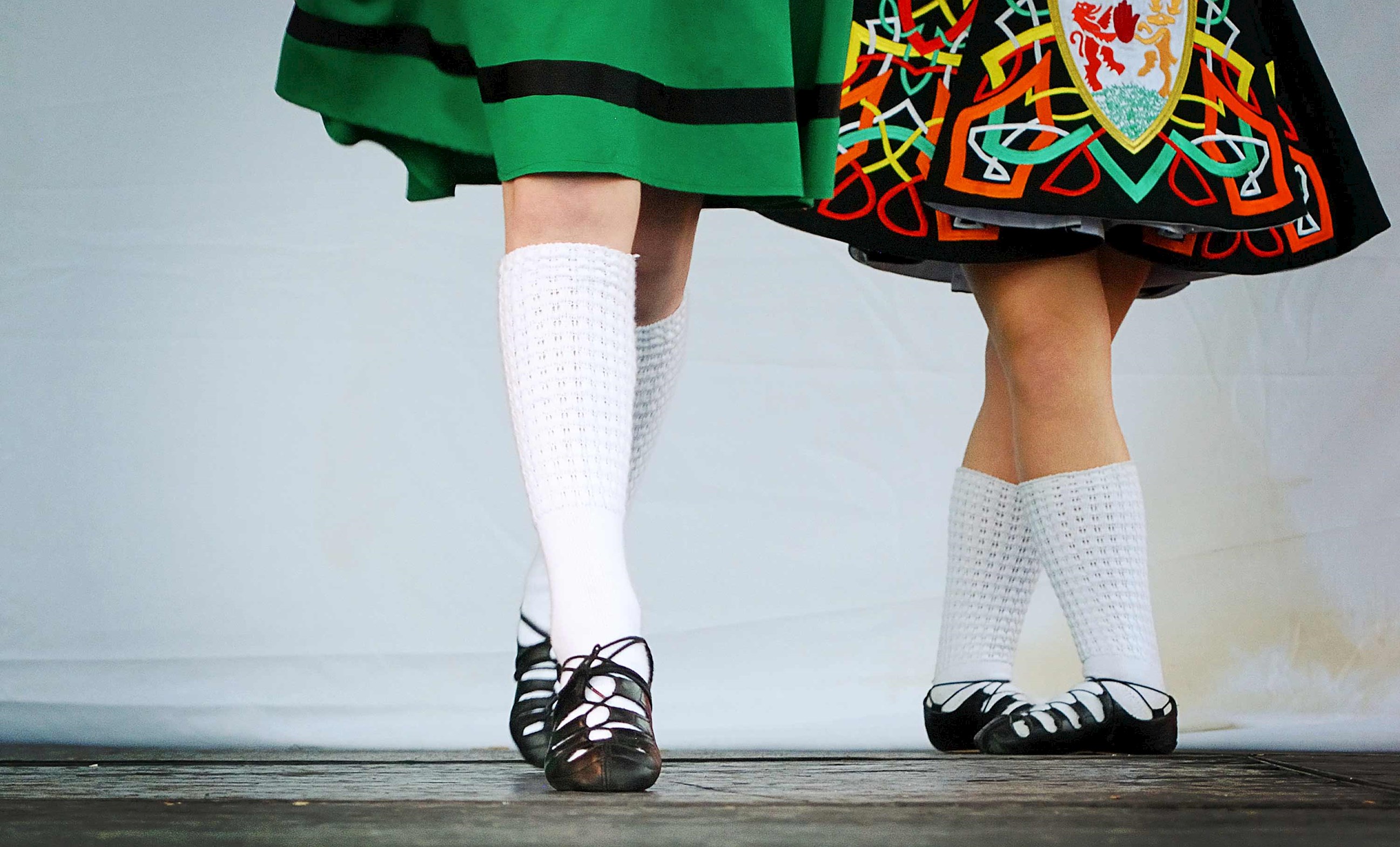 The feet of two traditional Irish dancers showcasing the music of Kerry