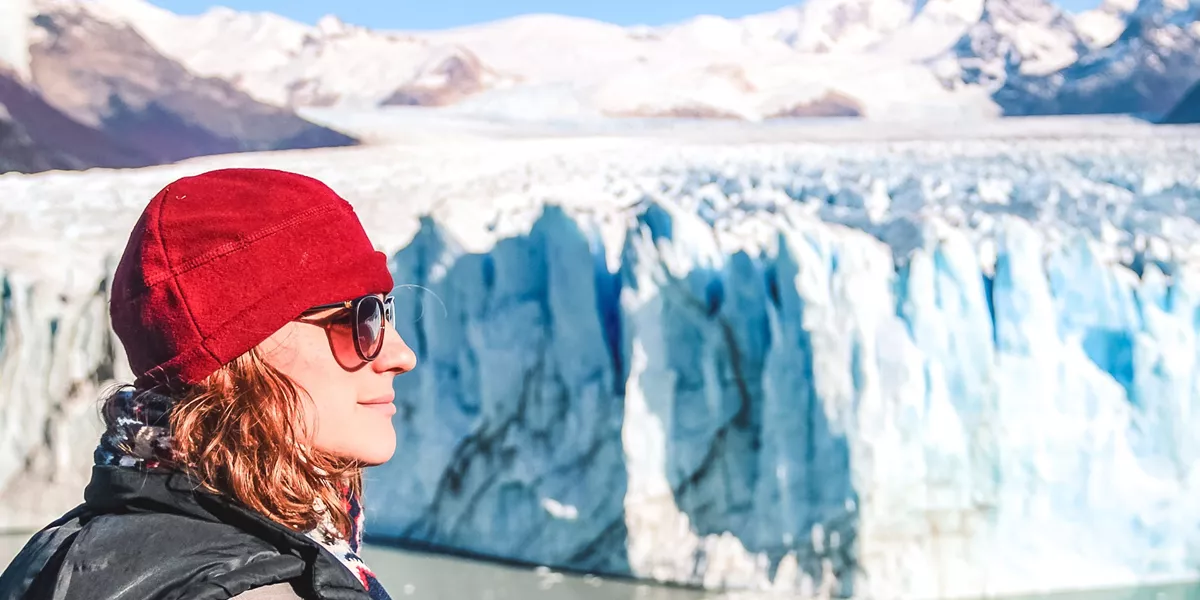 Woman looking at a glacier at the UNESCO-listed Los Glaciares National Park in Patagonia