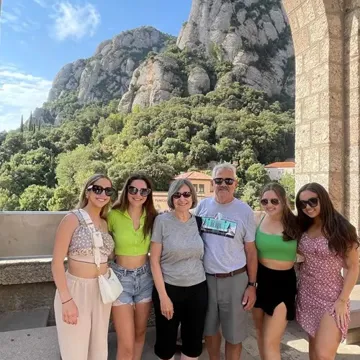 Multigenerational trip people with a mountain view in the background in Spain