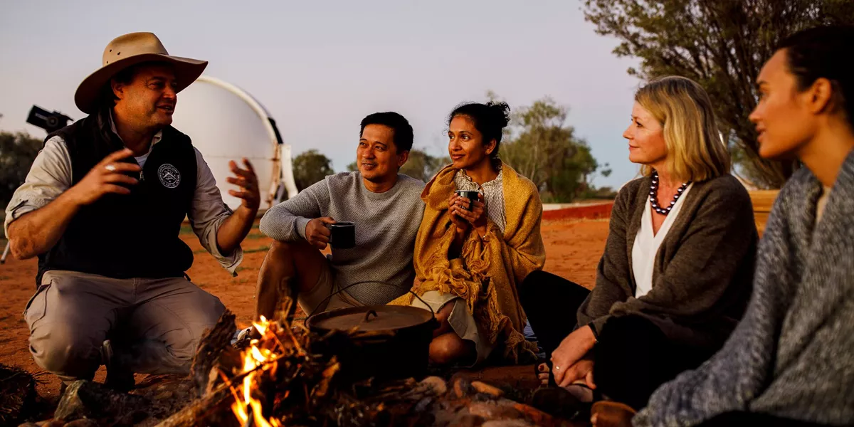 The Furzon Brothers telling a story around a fire in Australia