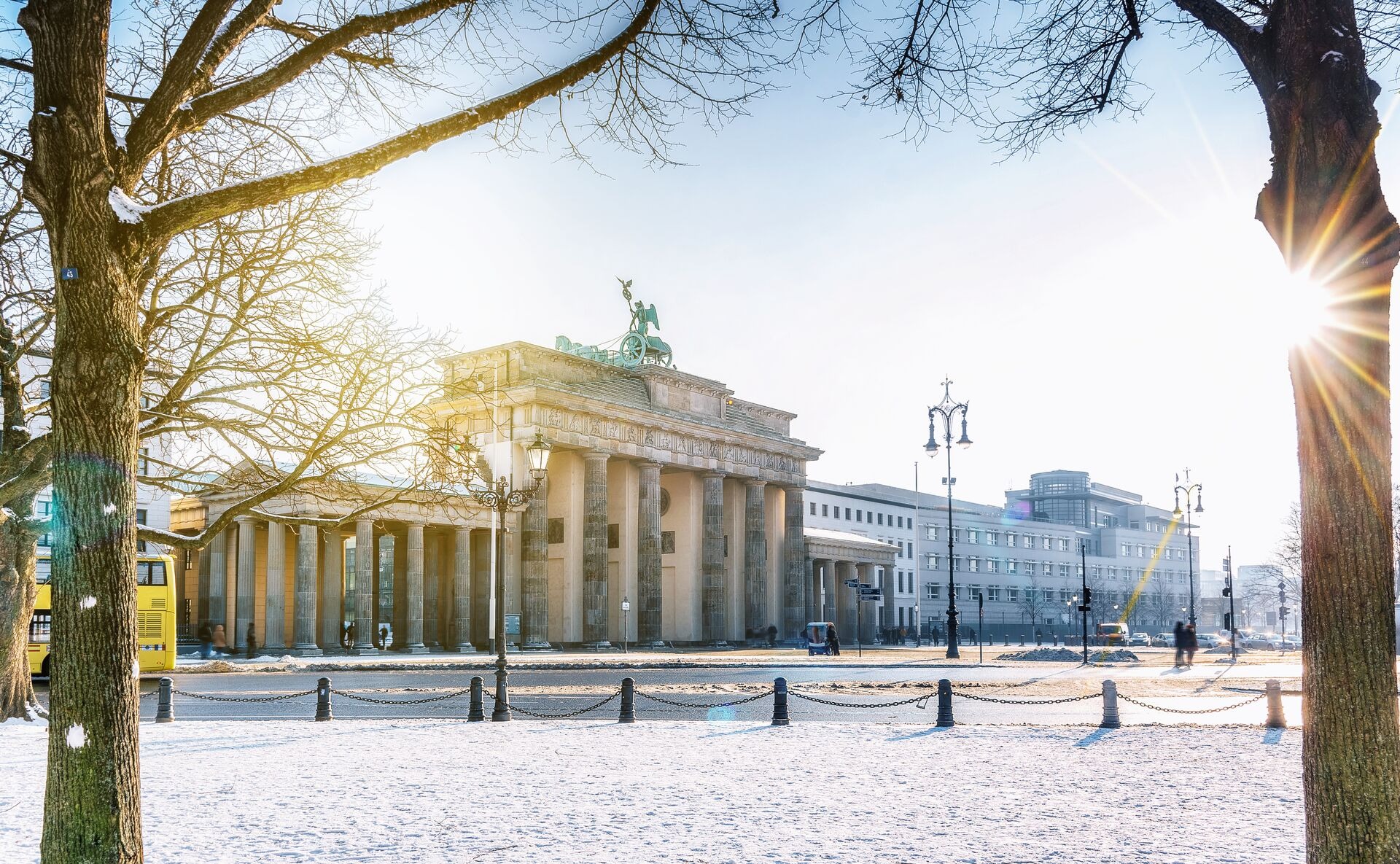 View on Berlin Brandenburger Gate with snow in morning sun, Germany