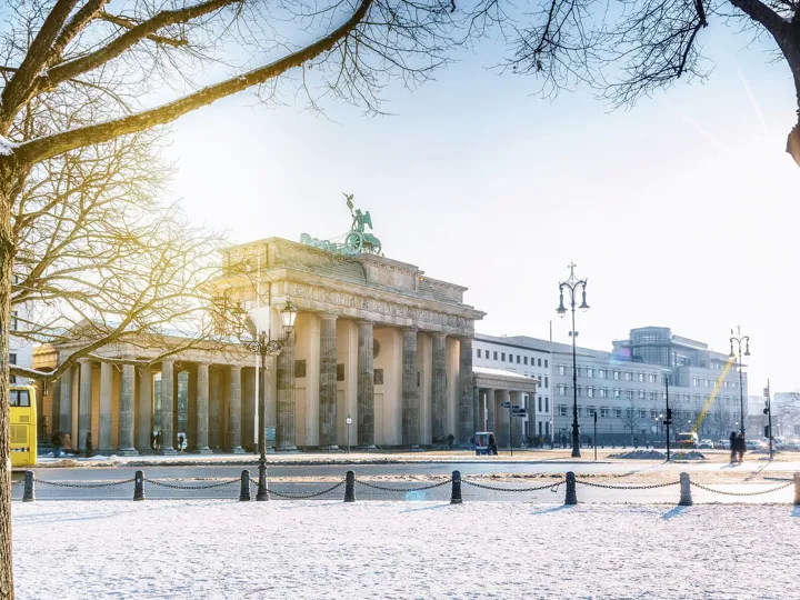 View on Berlin Brandenburger Gate with snow in morning sun, Germany