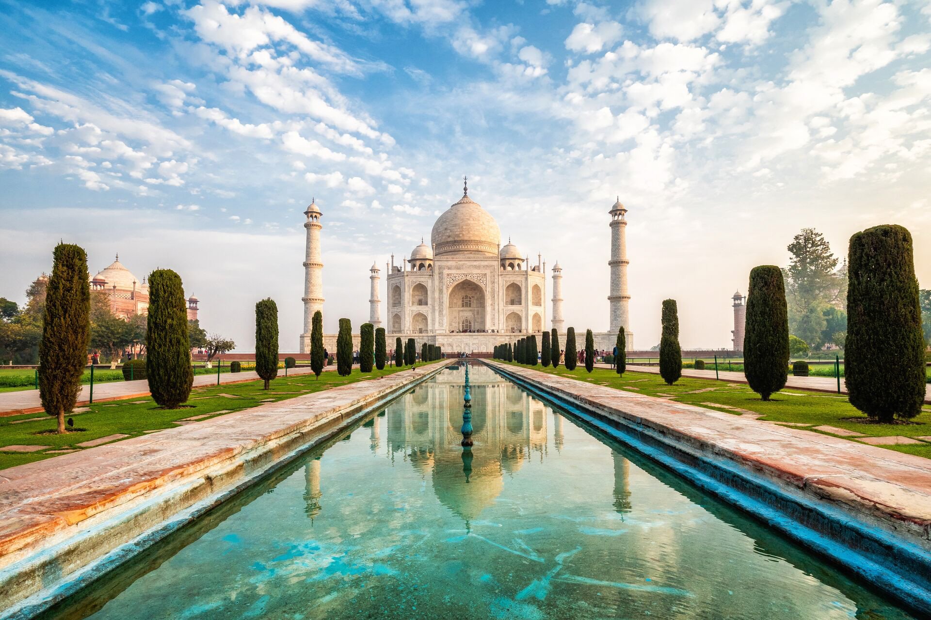 Pond view of the Taj Mahal with rows of cypresses on both sides, Agra, India