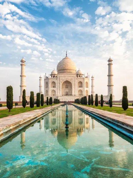 Pond view of the Taj Mahal with rows of cypresses on both sides, Agra, India