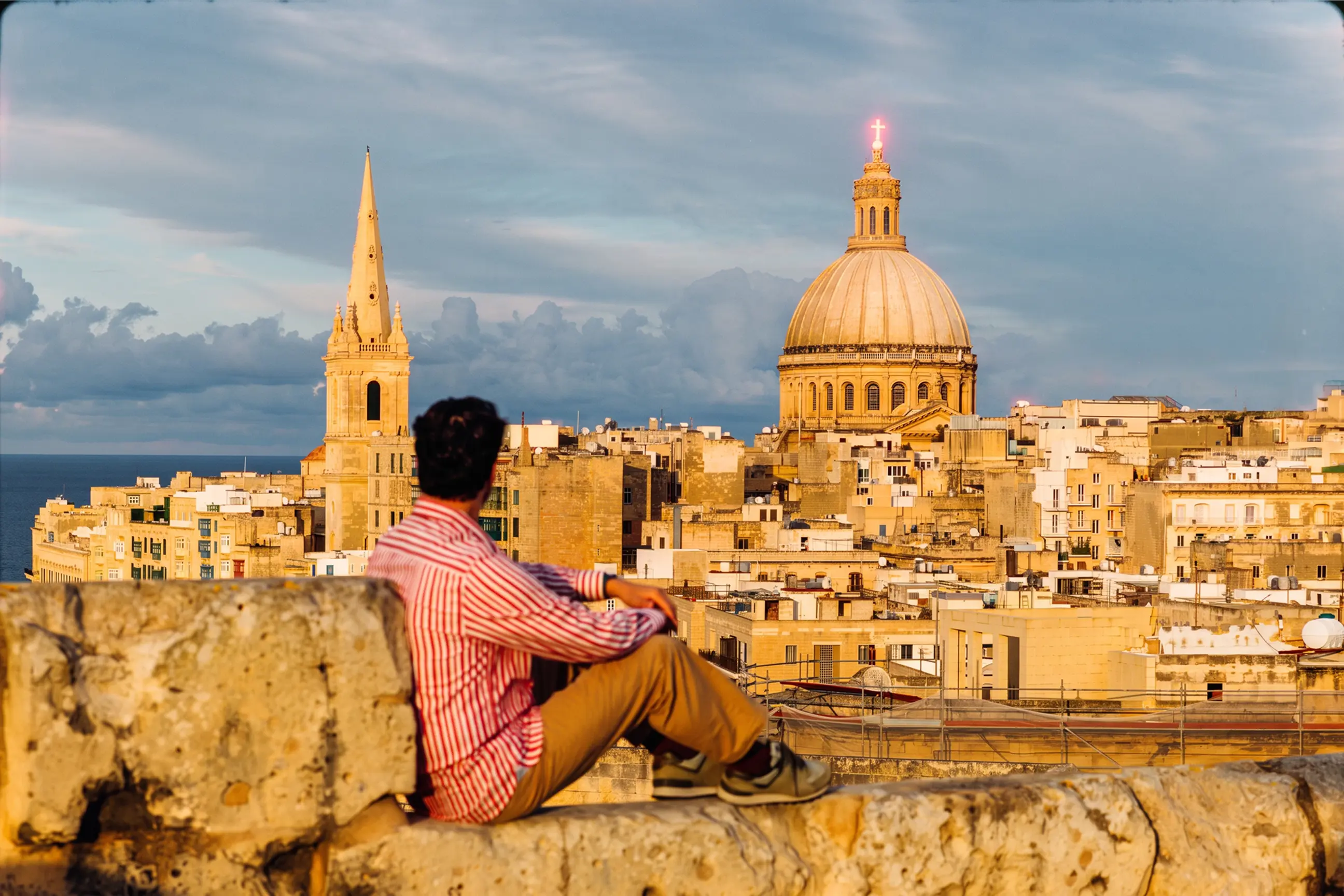 day-hero-man-looking-at-valletta-cityscape-valletta-malta-2273572947.webp