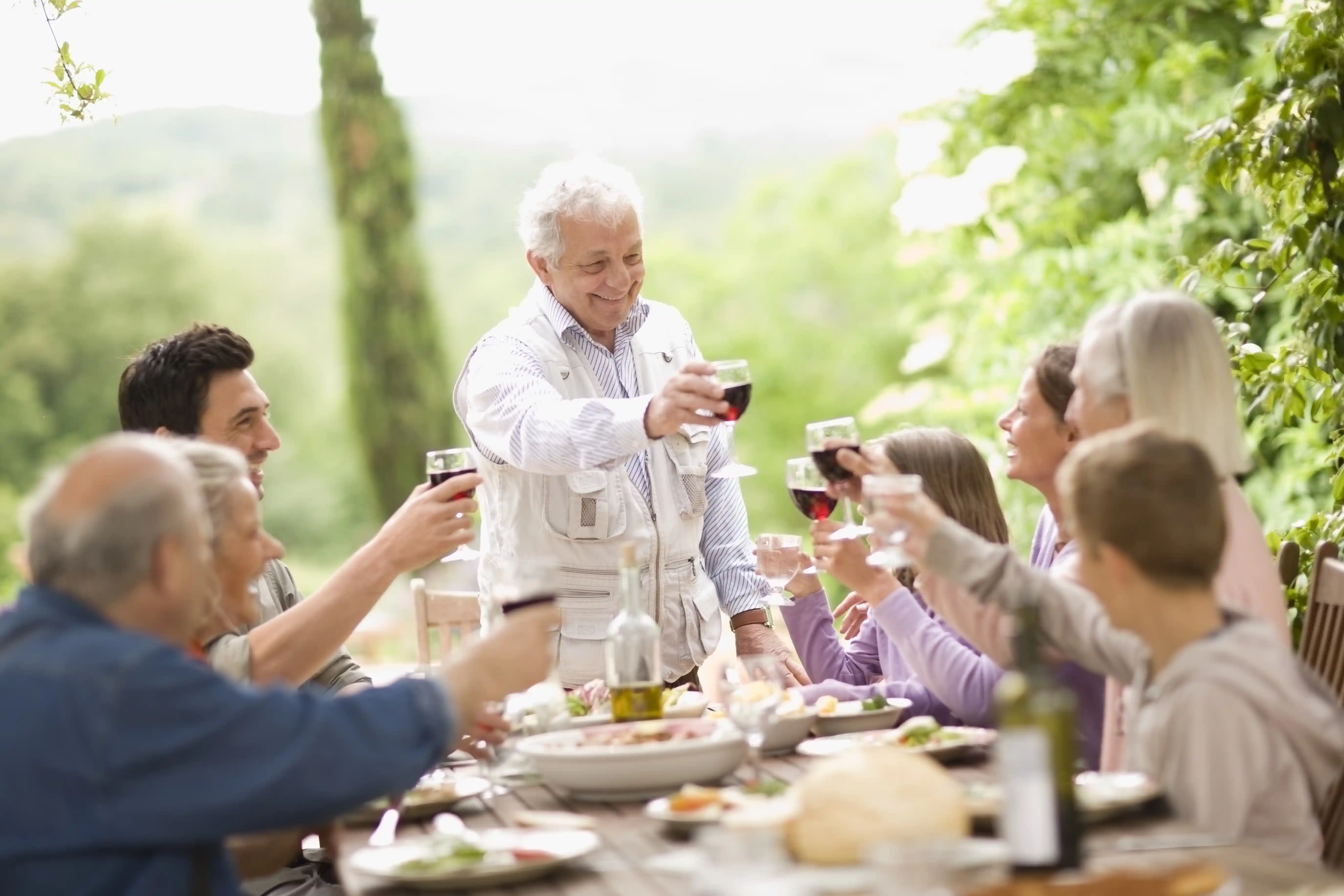 Family With Teenage Children Enjoying Lunch Alfreso