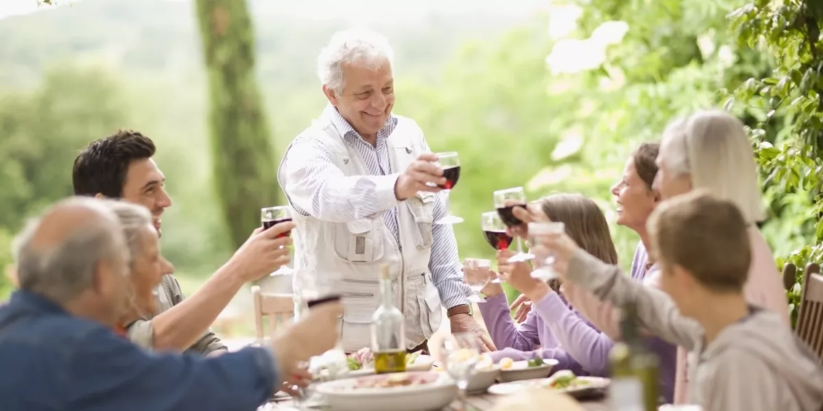 Family With Teenage Children Enjoying Lunch Alfreso