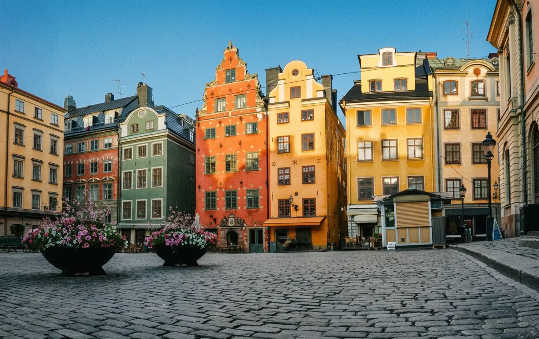 day-hero-colorful-houses-on-stortorget-square-stockholm-sweden-840806302.webp