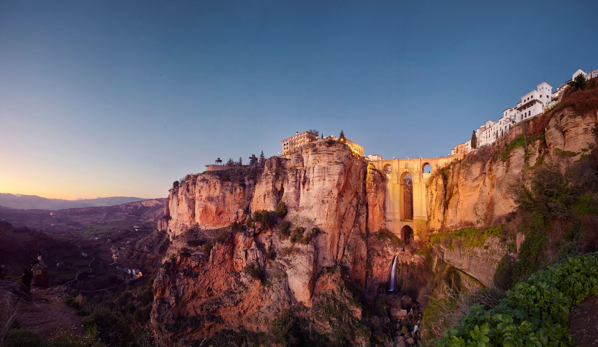 Puente Nuevo And The City Of Ronda At Dusk Malaga Spain
