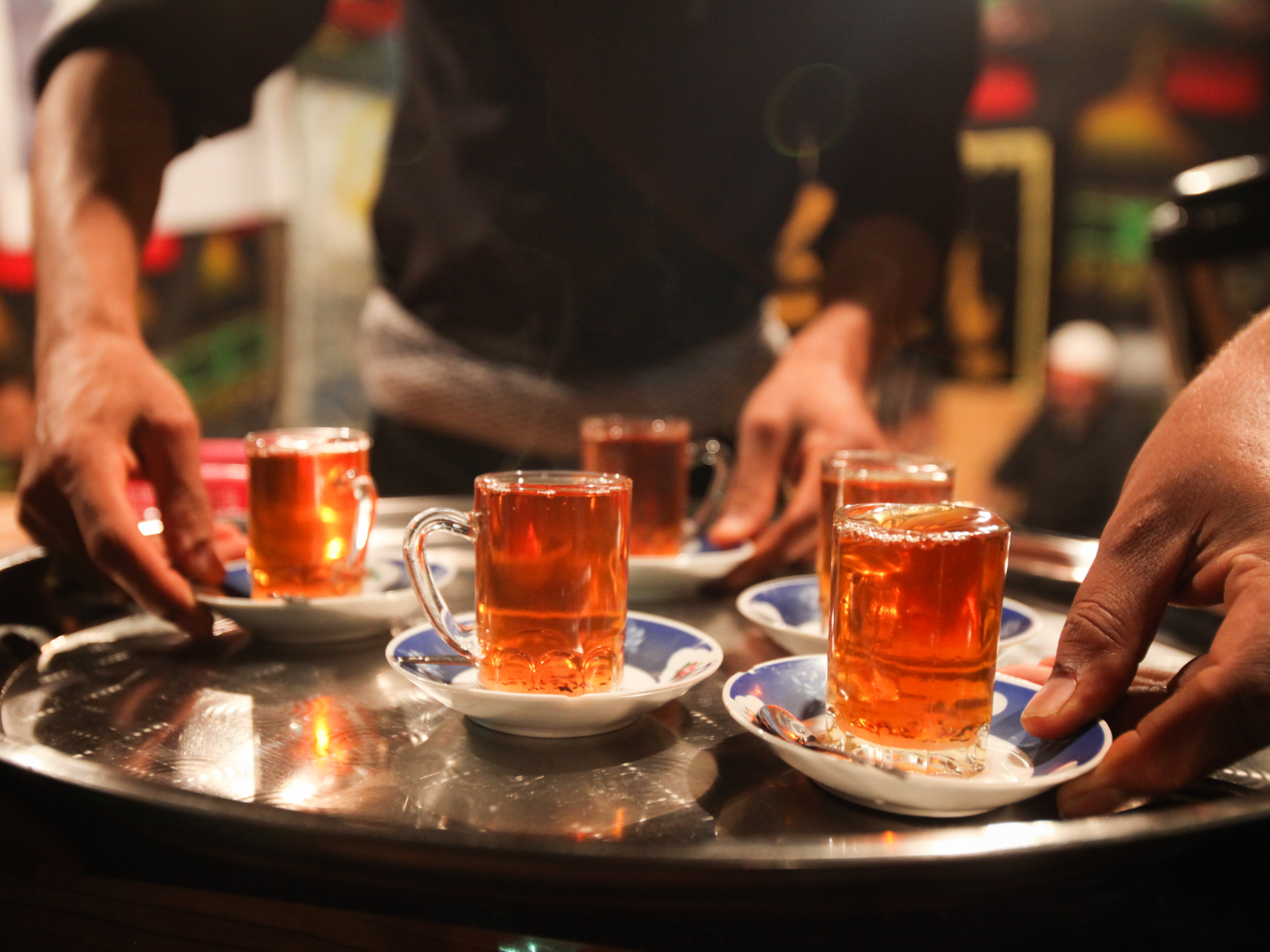Silver tray with cups of tea