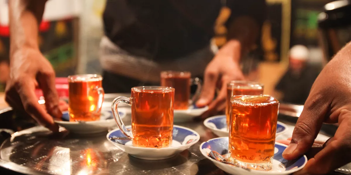 Silver tray with cups of tea