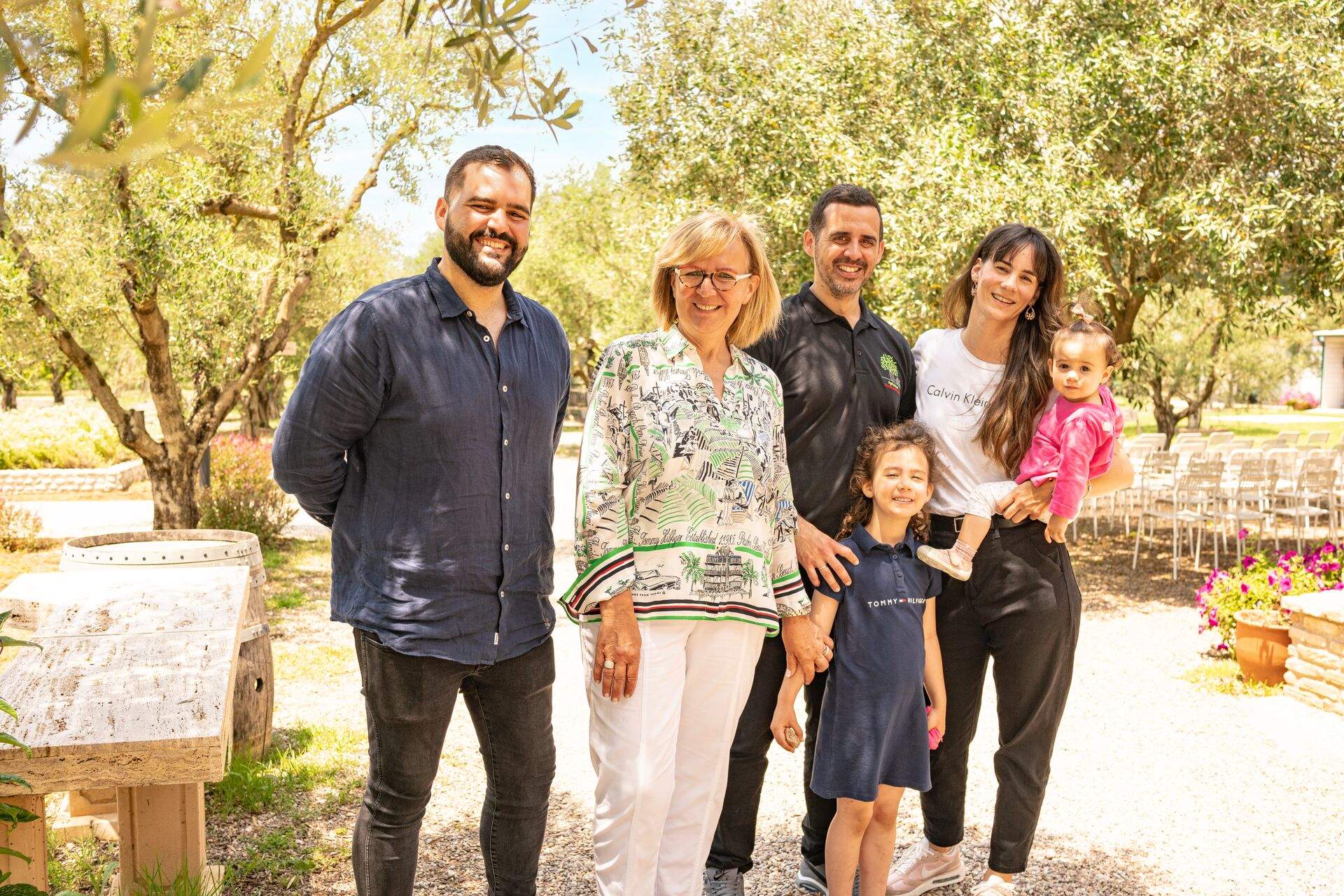 Karabelas Family standing outside at summer in Magna Grecia, Greece