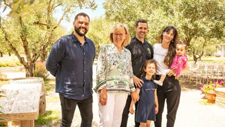 Karabelas Family standing outside at summer in Magna Grecia, Greece