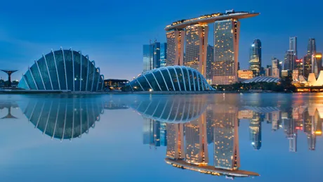 Reflections of modern buildings in water a night, Gardens By The Bay, Singapore