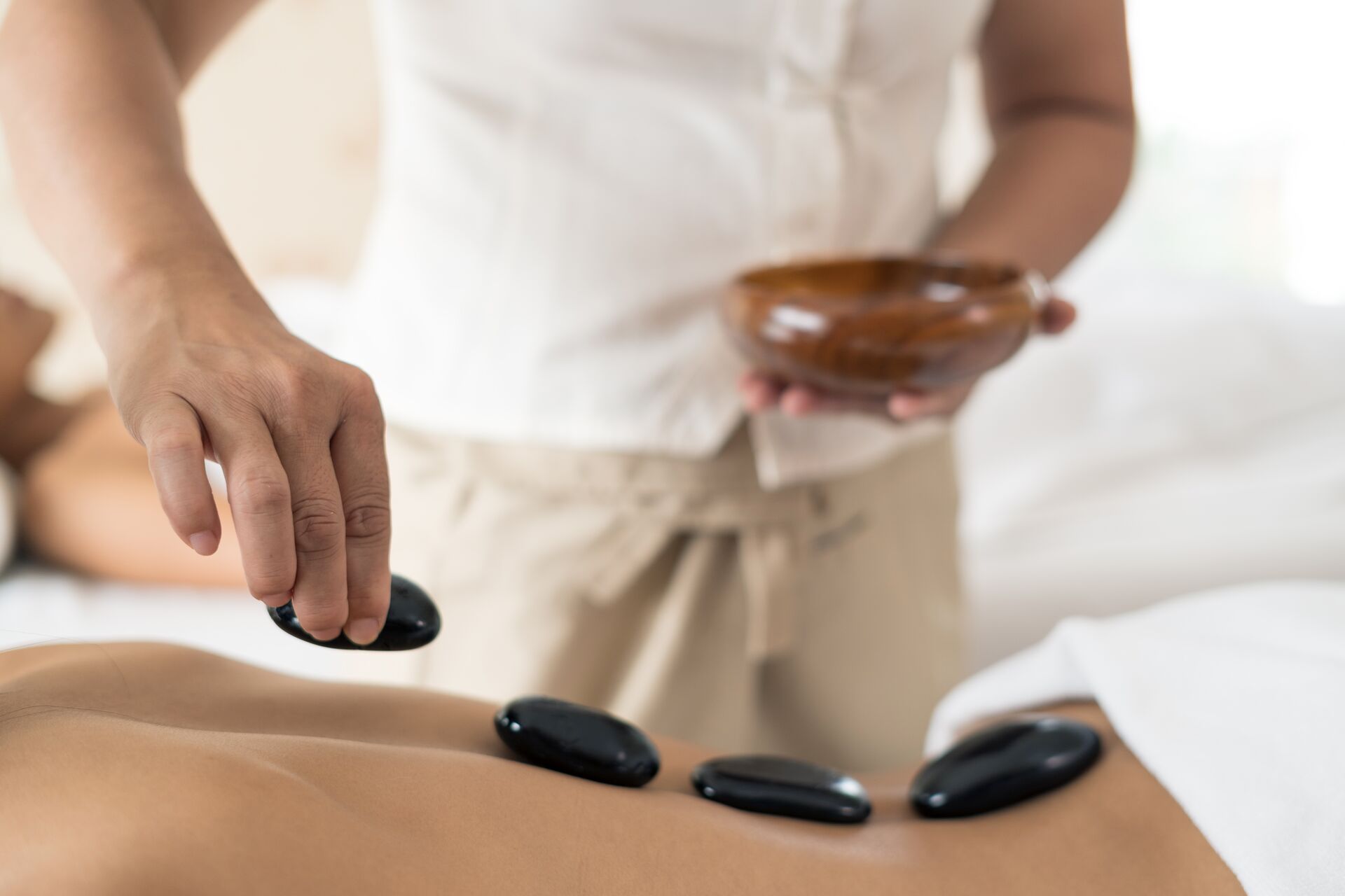 Hot stone massage therapy technique