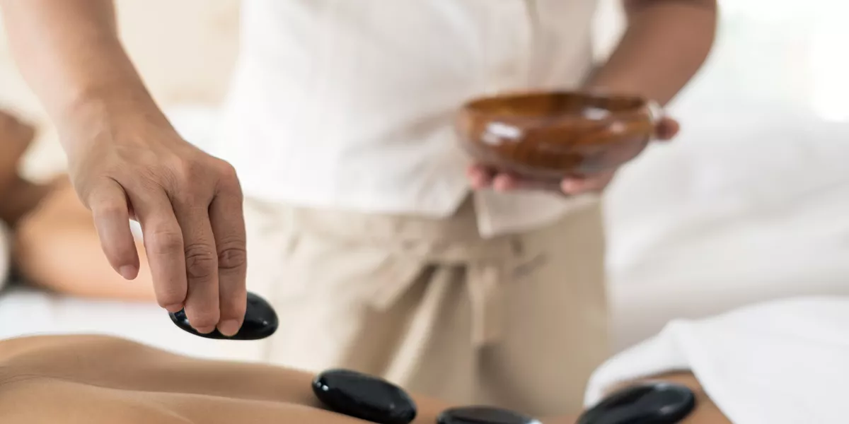Hot stone massage therapy technique