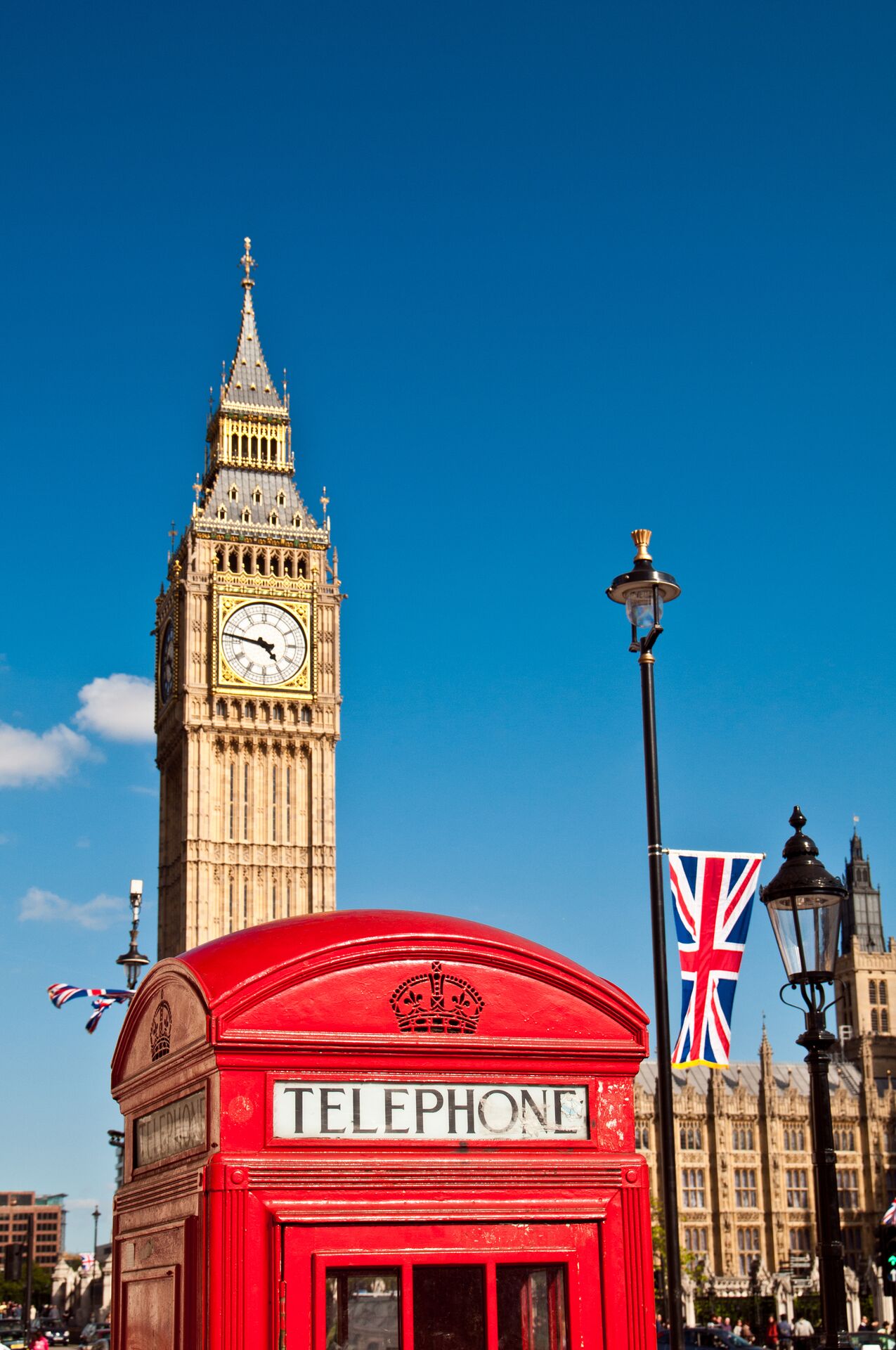 Telephone box in front of Big Ben and Union Flag