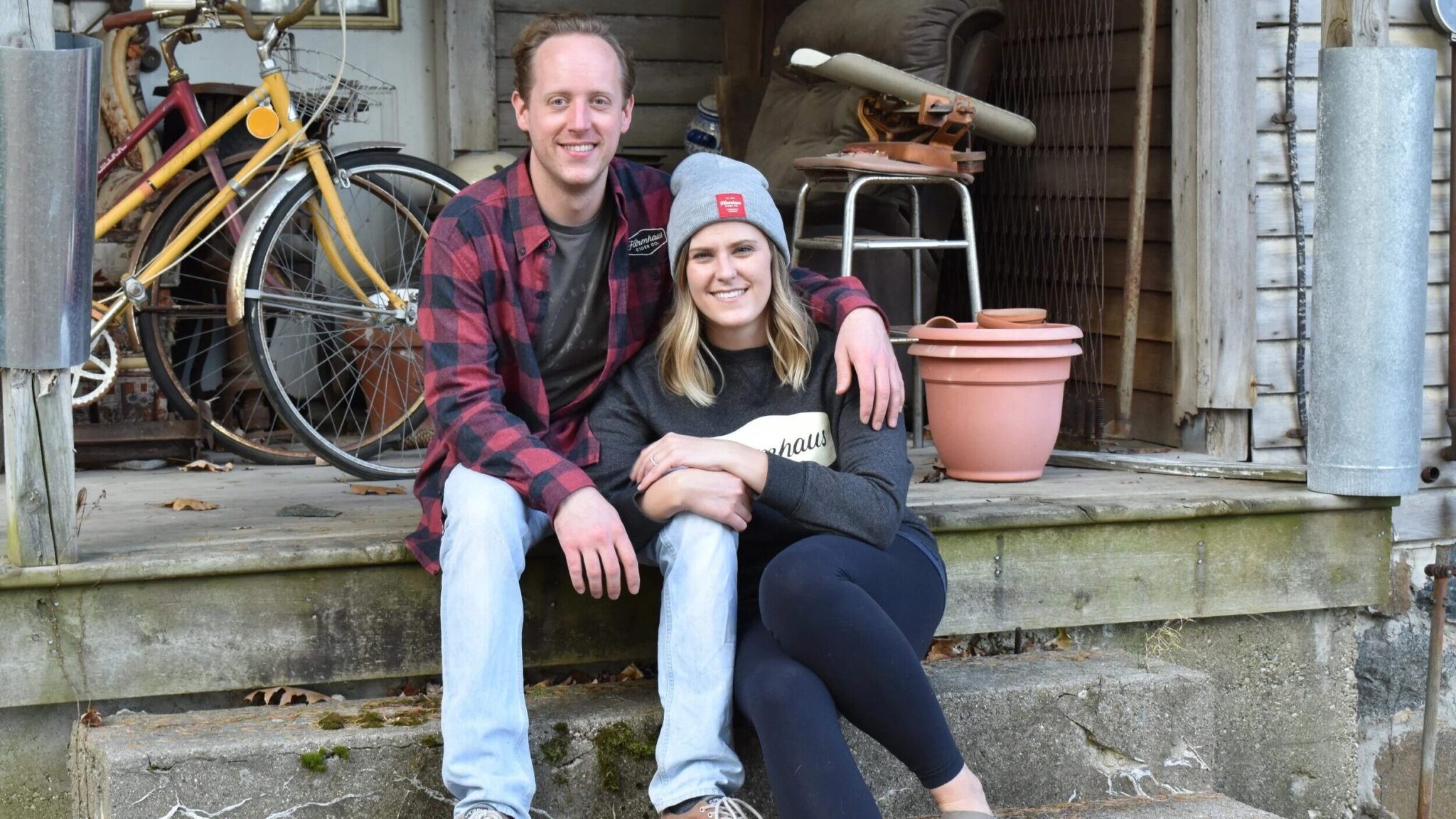 John And Megan Sitting On Porch Of A House