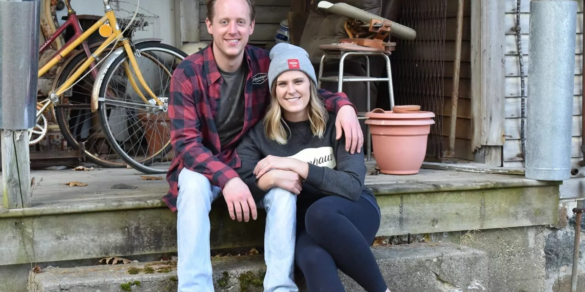 John And Megan Sitting On Porch Of A House