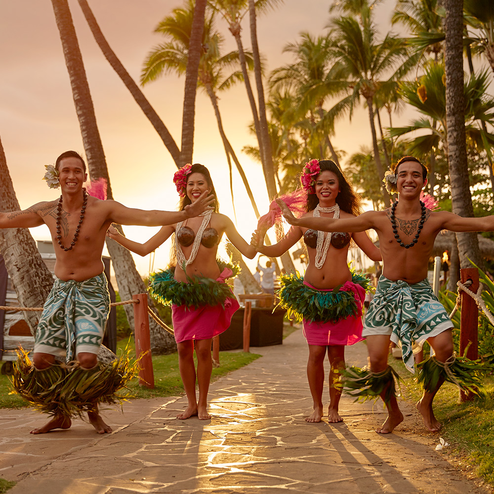 Hula dancers in Hawaii by sunset