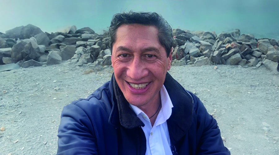 Travel Director Marty stood in front of rocks