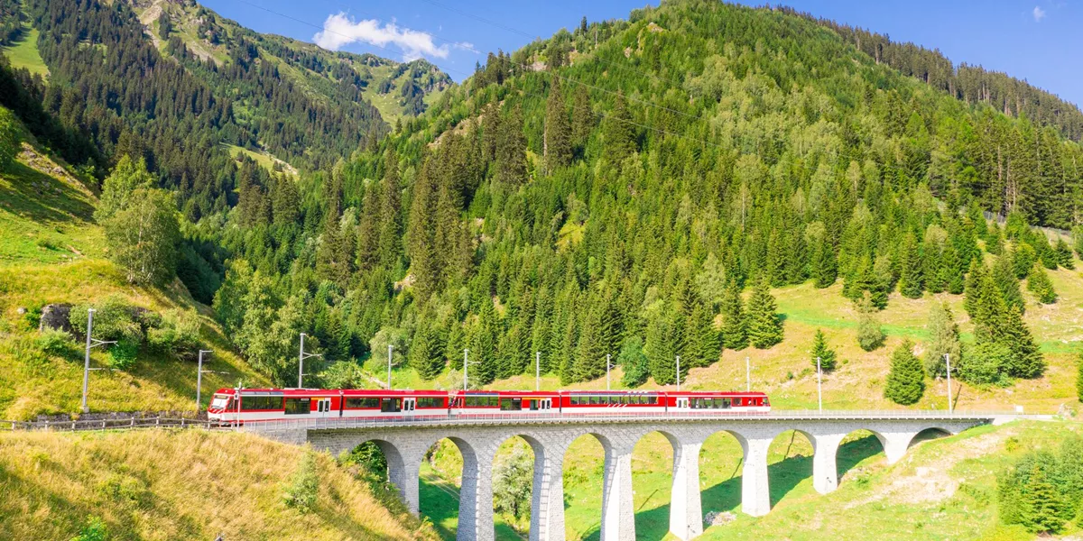 Glacier Express Train on Tujetsch Viaduct during summer in Switzerland