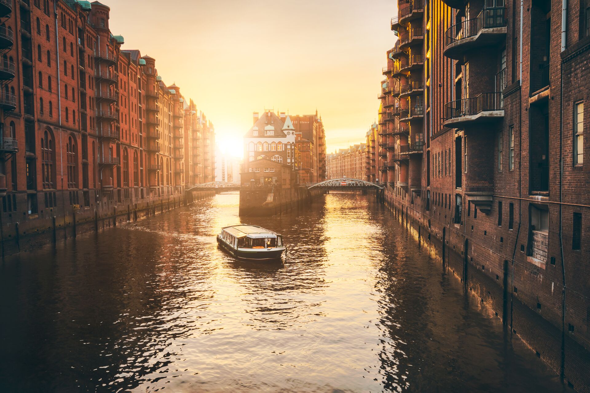 sun setting over a canal in Hamburg, Germany