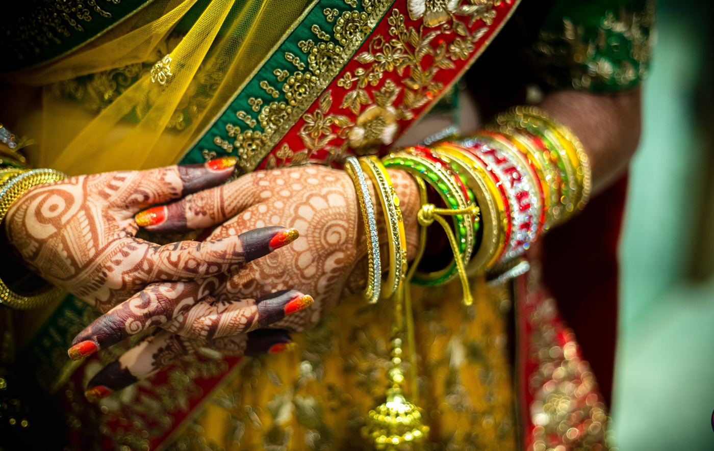 midsection-bride-with-hands-clasped-mumbai-india.jpg