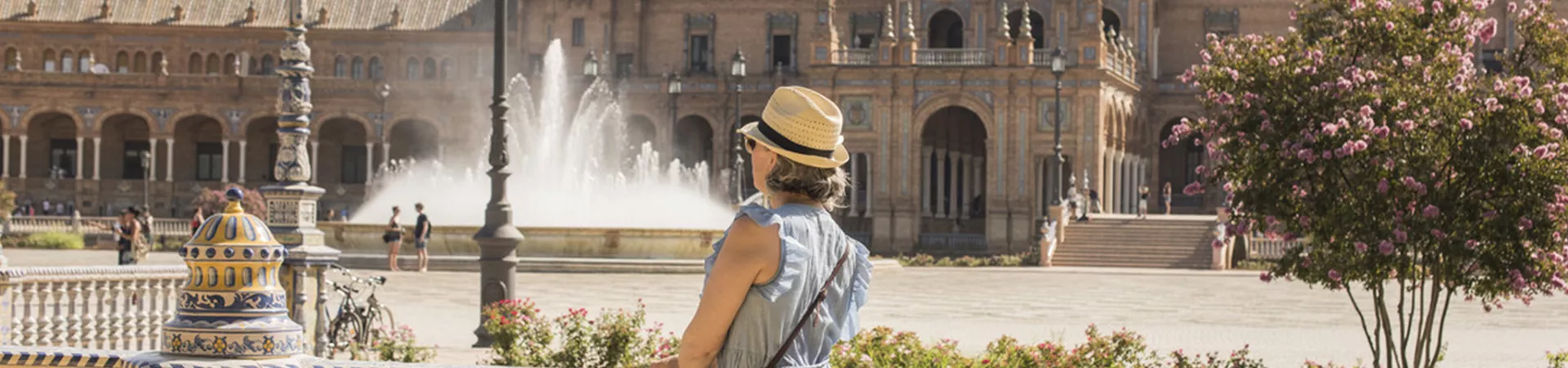 A traveller visiting Plaza de Espana in Seville, Spain