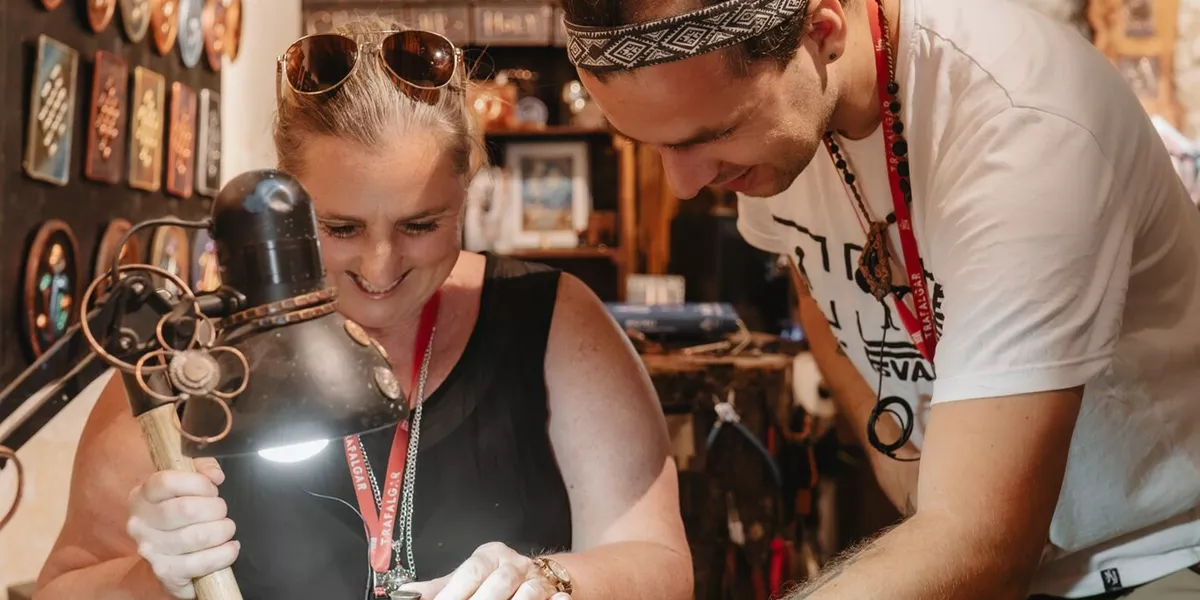 A woman takes part in a copper workshop