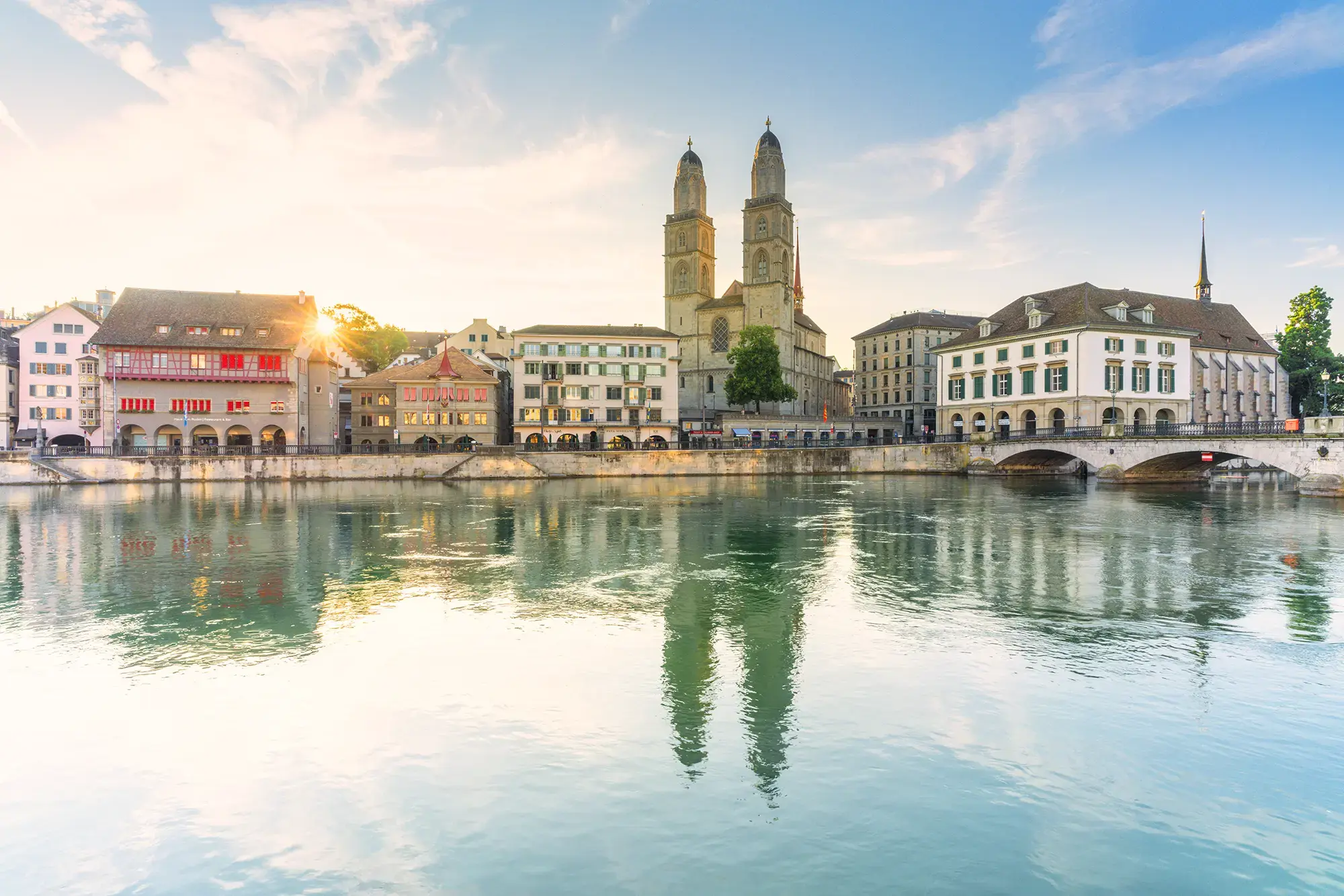 grossmunster-cathedral-and-limmat-river-zurich-1180989373.webp