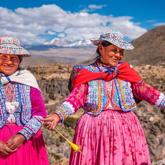Peruvian women spinning wool by hand near Colca Canyon, Peru