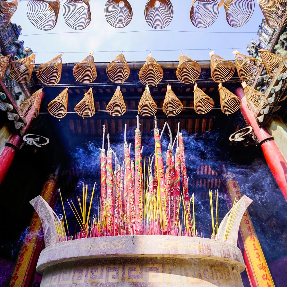 Burning incense sticks in Chua Ba Thien Hau Pagoda in Ho Chi Minh City, Vietnam
