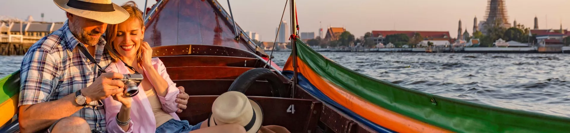 Couple on boat viewing images on camera