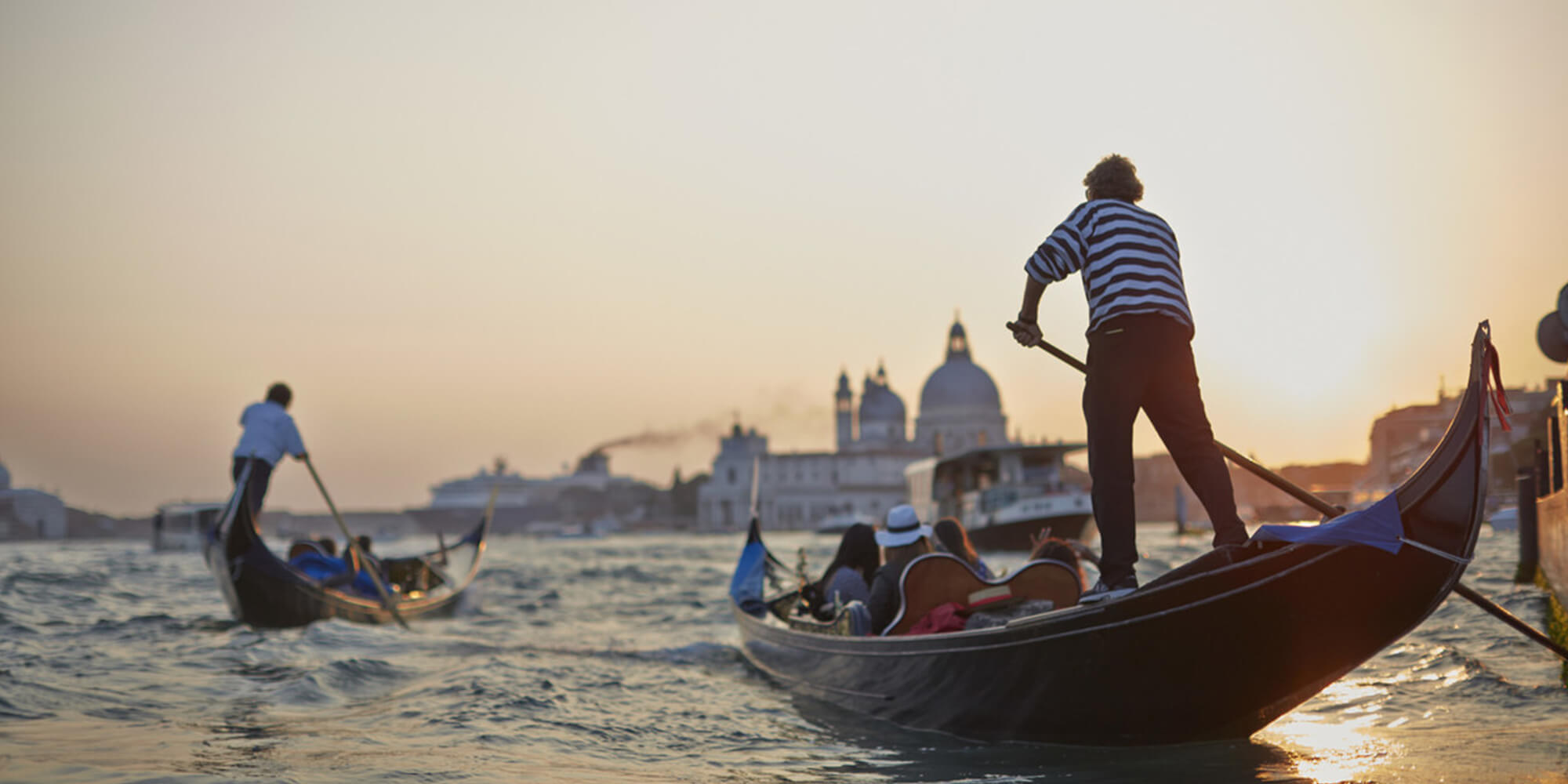 Gondolas in Venice by sunset