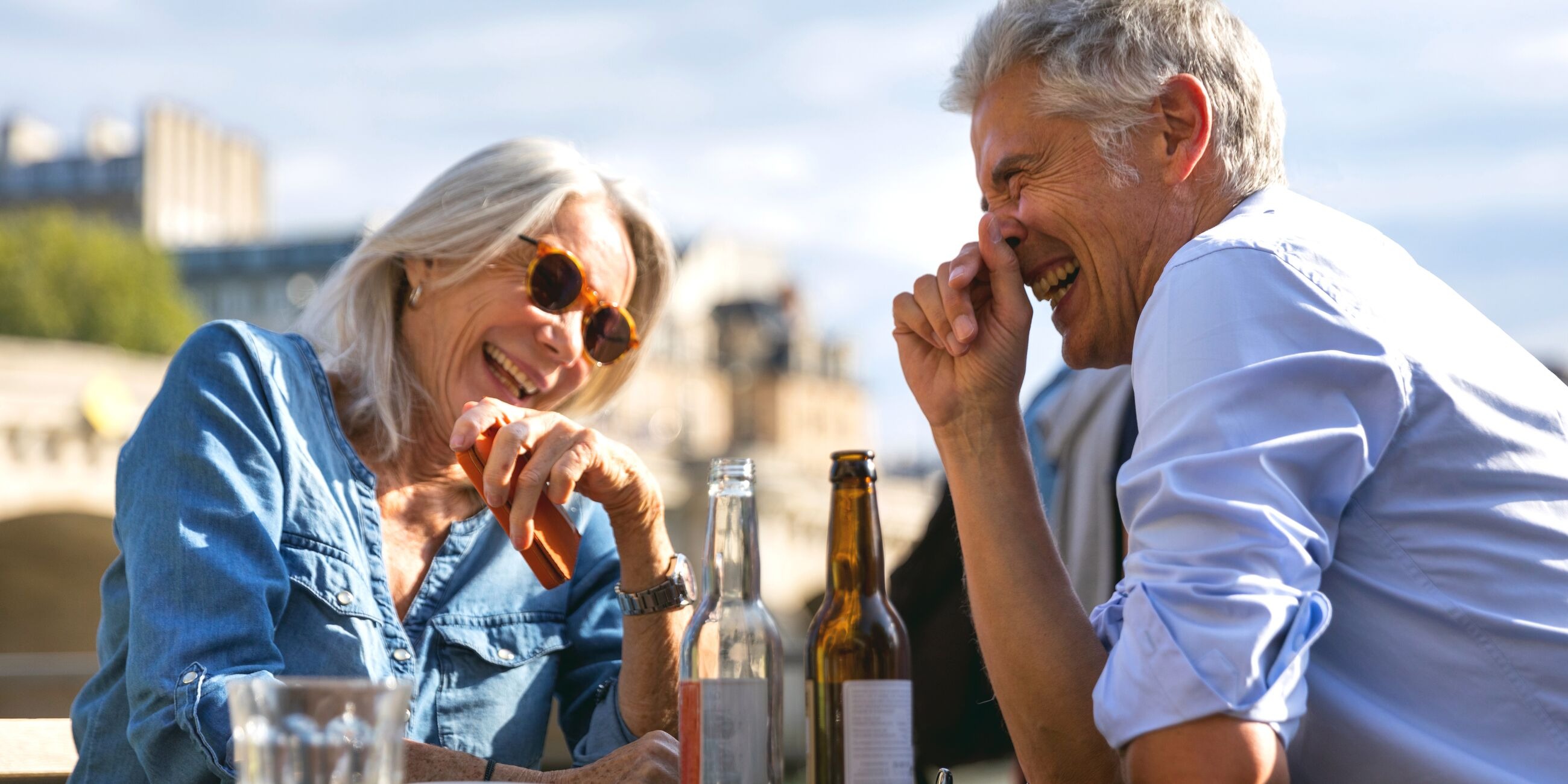 Seniors having fun drinking outside