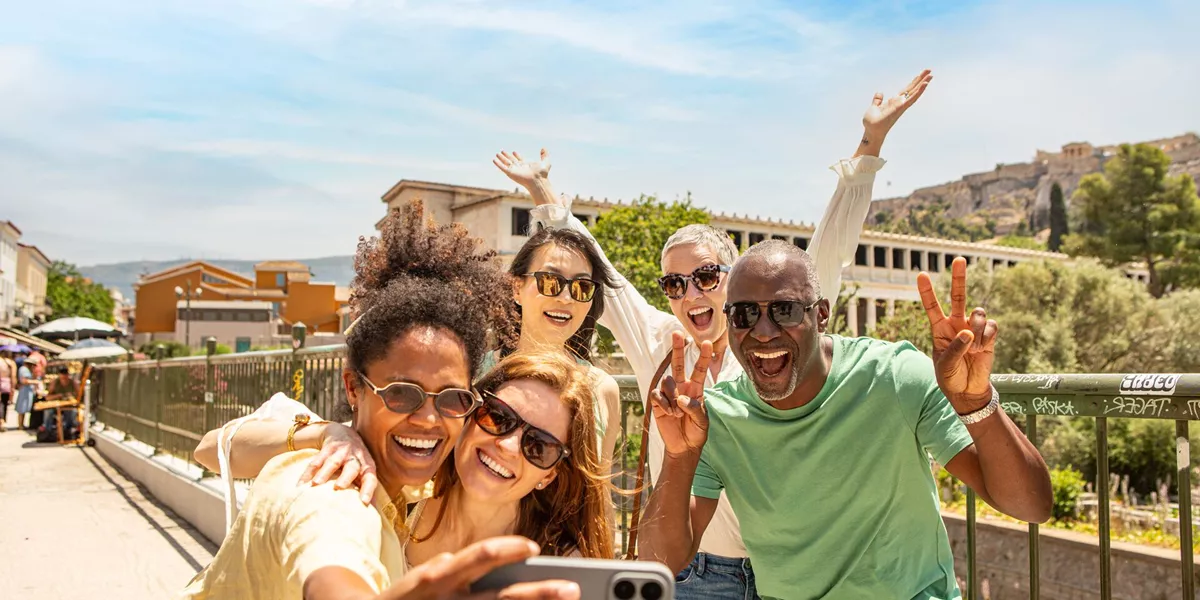 Guests taking a selfie while sightseeing in Athens, Greece