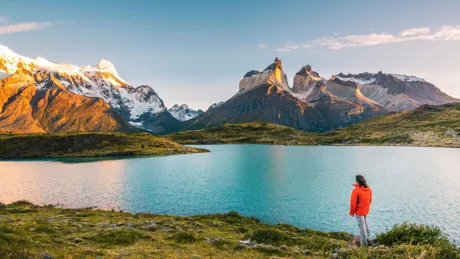 Tourist admiring The Cordillera Paine in Torres Del Paine National Park in Chile
