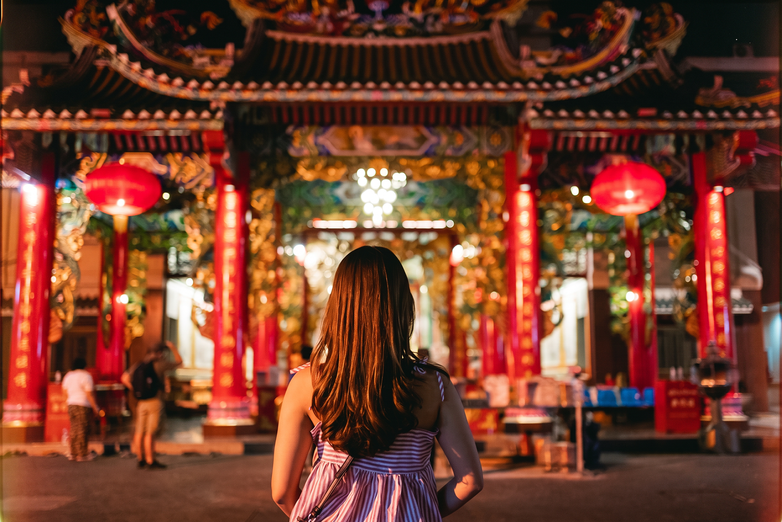 day-hero-woman-standing-at-chinese-temple-bangkok-thailand-1461416435.webp