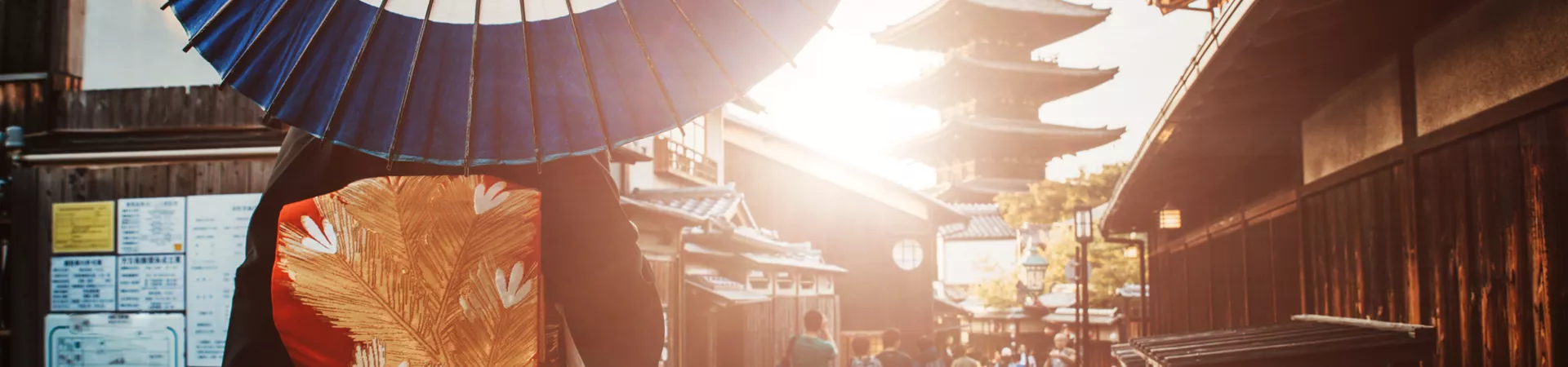 Woman in geisha costume with an umbrella