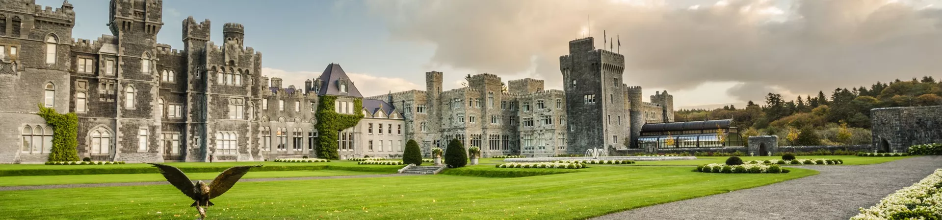 Ashford Castle with lawn and bird in the foreground